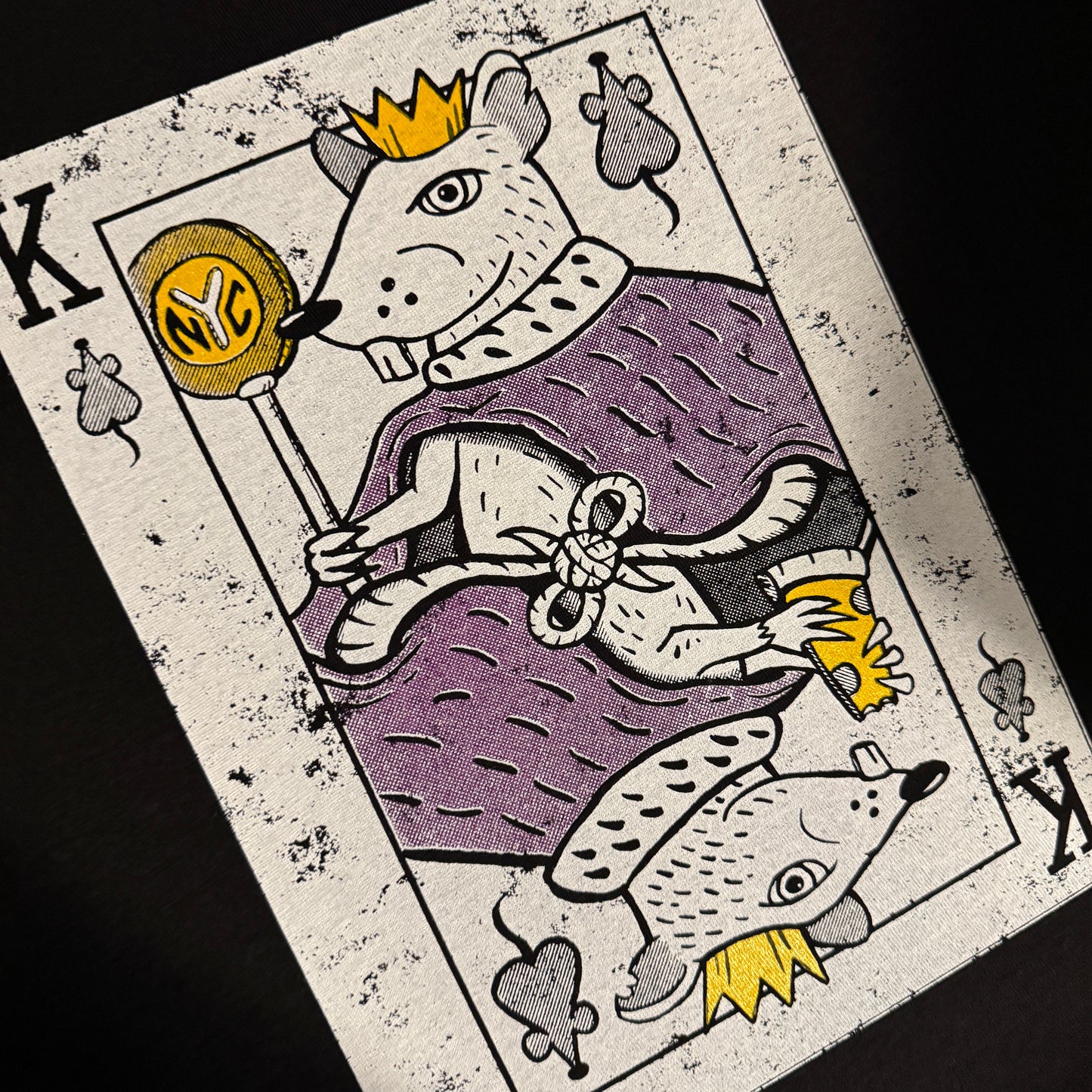 Playing card with cartoonish rat characters on a dark background