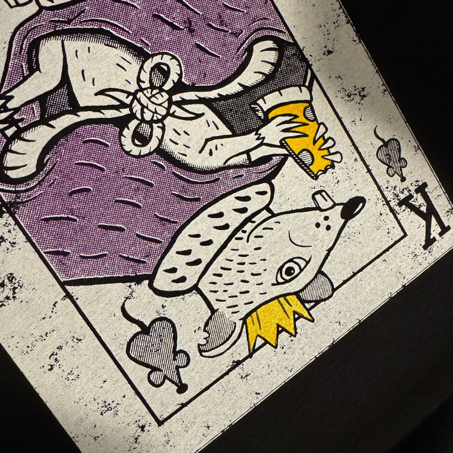 Vintage-style card with a stylized rat wearing a crown and royal cape on a dark background