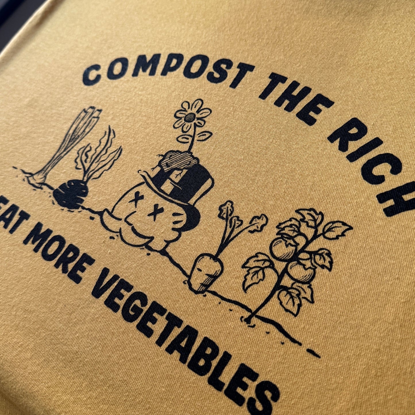 t-shirt with compost the rich, eat more vegetables text and illustrations.