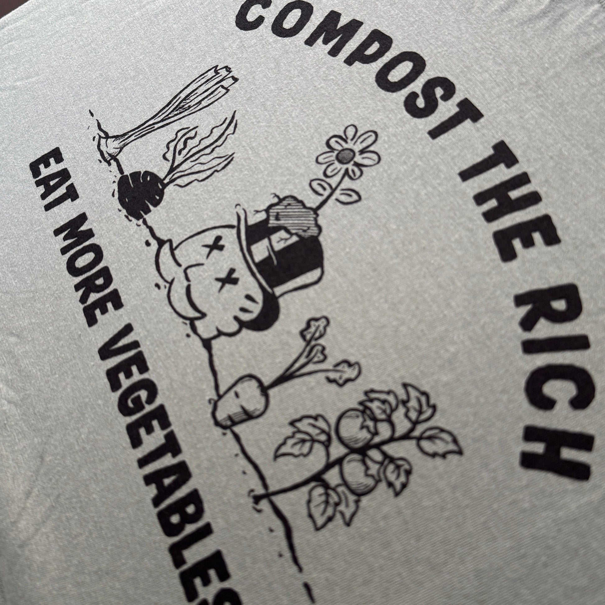 green shirt with black text and illustrations on a white background